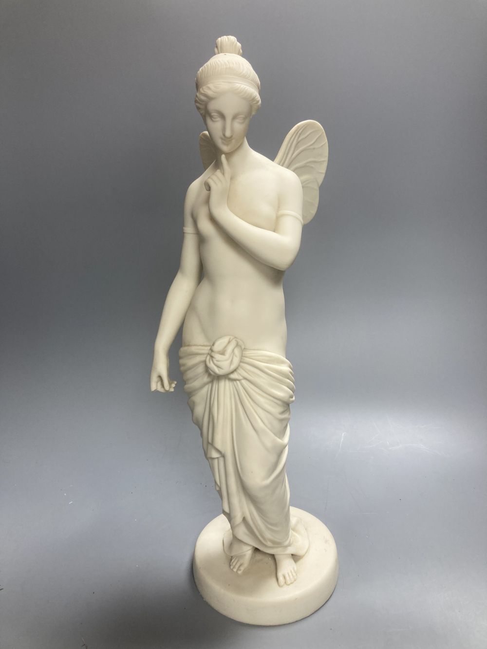 A Copeland Parian figure of a winged maiden and a later composition figure of Venus bathing, H 43cm